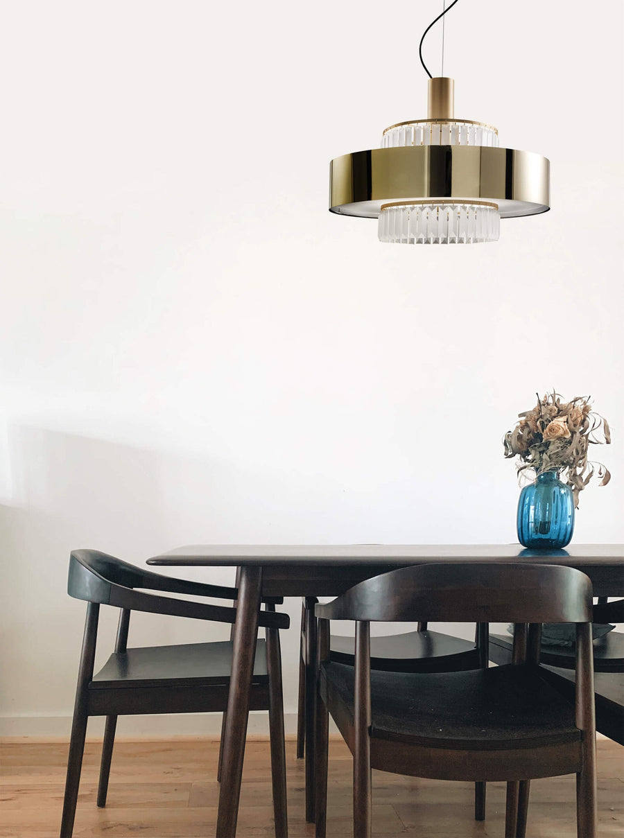 Luxury Italamp Crono Suspension Lamp in satin gold with crystal pendants, illuminating a stylish interior space, offered by Spacio India.