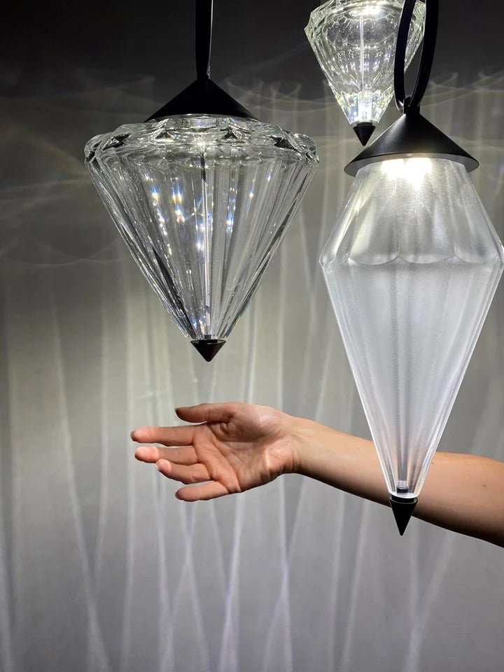 Hand interacting with the crystal diffuser of the Italamp Donna Suspension Lamp, highlighting the brilliance and material quality – Spacio India