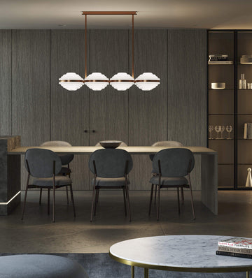 Italamp Ellepi chandelier in bronze metal with satin glass diffusers, suspended over a dining table – available at Spacio India for modern interiors.