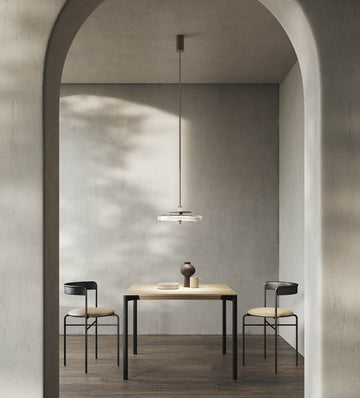 Italamp Gilda Suspension Lamp with hand-carved crystal diffuser in a soft grey modern dining setting. Luxury Italian lighting available at Spacio India.