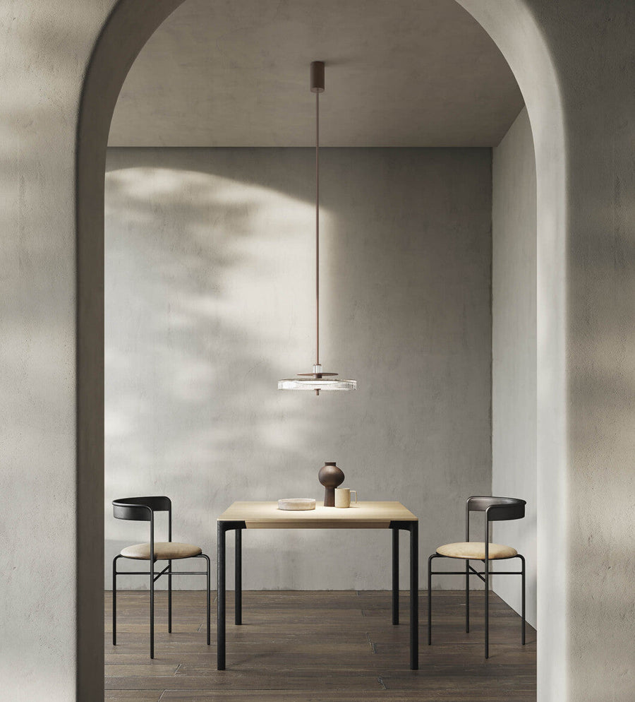 Italamp Gilda Suspension Lamp with hand-carved crystal diffuser in a soft grey modern dining setting. Luxury Italian lighting available at Spacio India.