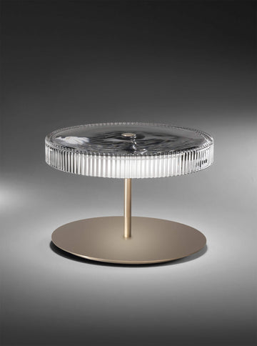 Designer lighting piece Italamp Gilda with warm corten base and rippled crystal top, ideal for luxury home decor, available at Spacio India.