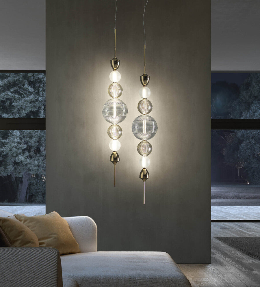 Dual Italamp Greta Suspension Lamps illuminating a modern living area, featuring crystal spheres and metallic accents – Spacio India exclusive.