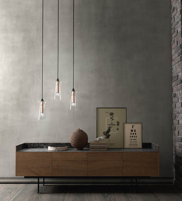 Italamp Licio pendant lamps in clear glass with copper accents, displayed in a modern living room setup. Available at Spacio India.