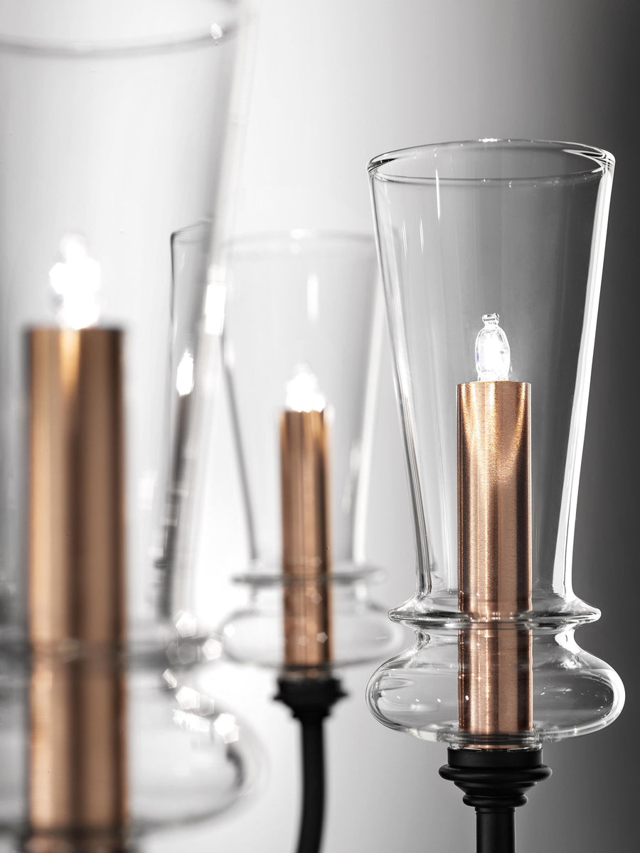 Detail shot of Italamp Licio chandelier showing precision glasswork and metallic candle-style holders. Find it at Spacio India.