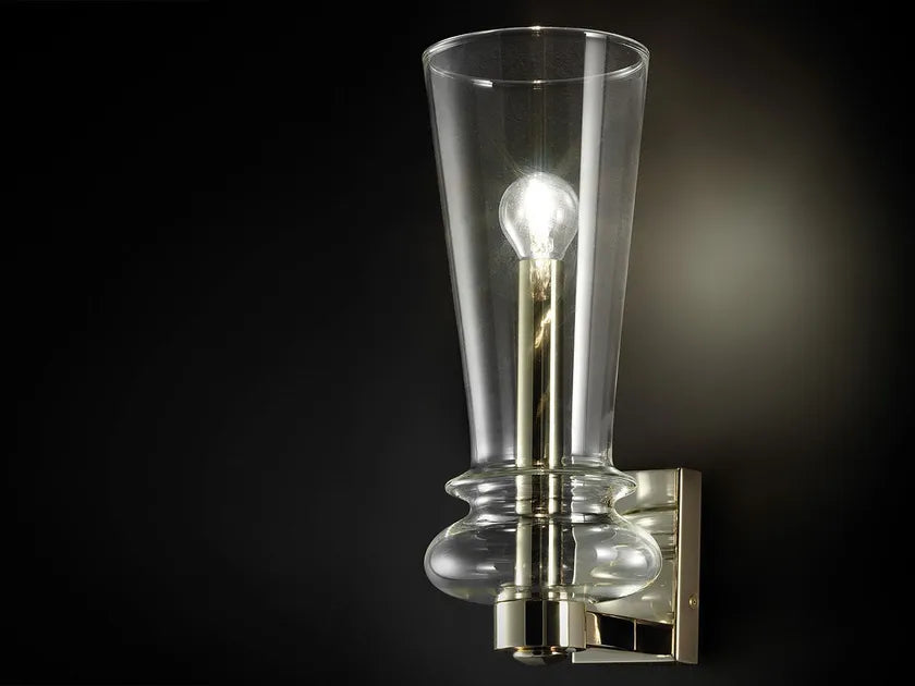 Italamp Licio wall lamp with soft ambient glow and metallic accents, elegant for modern and classical interiors. At Spacio India.