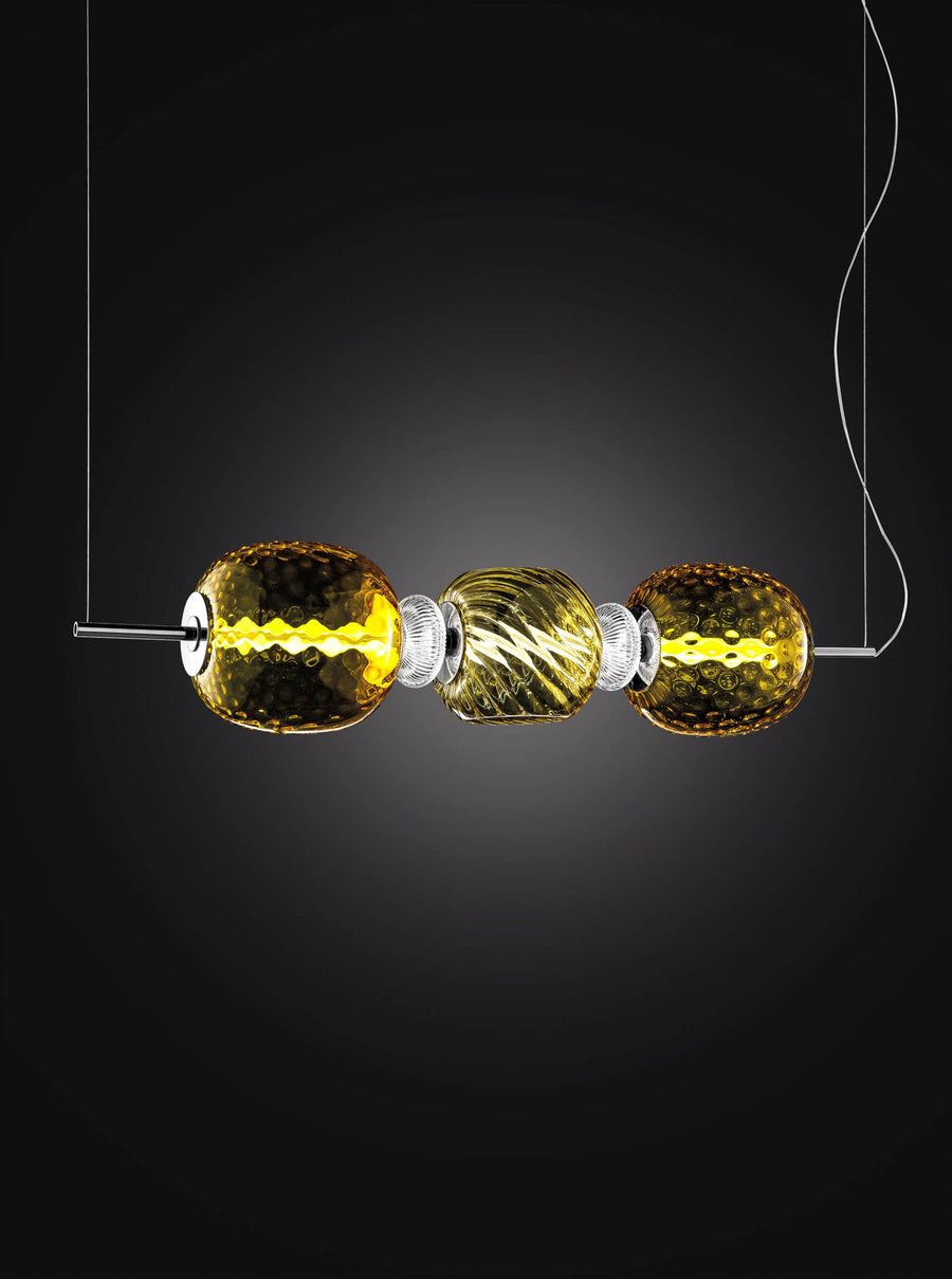 Italamp Rita Suspension Lamp glowing in dark backdrop, featuring golden blown crystal and LED light, Spacio India collection