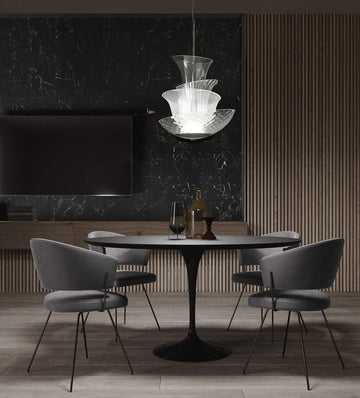 Modern dining room with Italamp Trevi Suspension Lamp from Italy, featured at Spacio India. The sculptural glass design adds elegance above a round dining table.