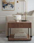 Wooden side table with  vase from Jonathan Adler in a living room setting from Spacio