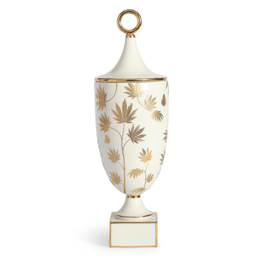 A Jonathan Adler JA Vase Botanist Ganja Urn with gold leaves on it.