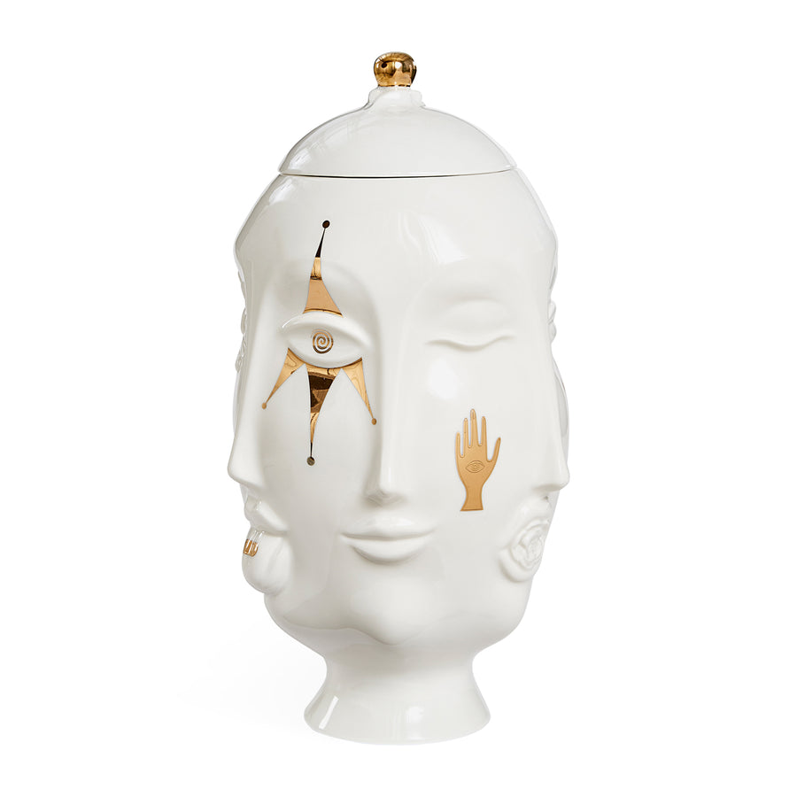 The Vase Glided Muse Frida Urn by Jonathan Adler is a charming white ceramic jar adorned with a face, perfect for adding a touch of artistic flair to your space. It is part of the Muse collection by Jonathan Adler.