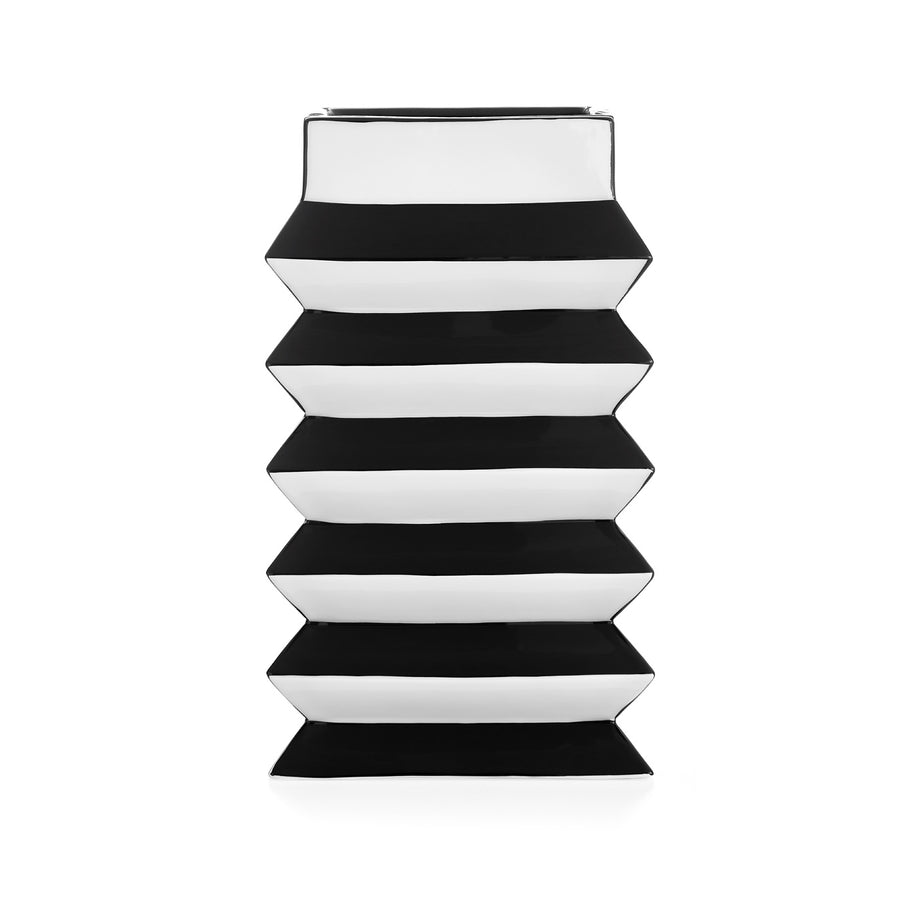 A stack of JA Vase Pleat Medium Black White boxes on a white background, inspired by Wiener Werkstätte design by Jonathan Adler.