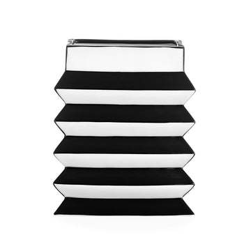 A stack of JA Vase Pleat Small Black White trays by Jonathan Adler on a white background, showcasing contemporary artistry.