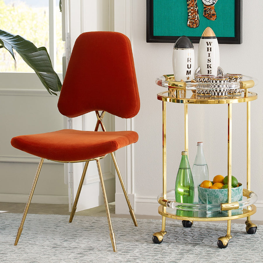 Rum & Whiskey decanters from Jonathan Adler with a bar accessories in a interior space.