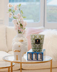 Lacquer Arcade Medium Blue Box by Jonathan Adler with a Salvador vase & Baobab candle on coffee table available at Spacio India for luxury home decor accessories collection of decorative boxes.