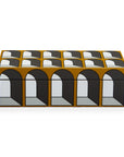 The JA Lacquer Arcade Box Small, by Jonathan Adler, features a sleek rectangular design adorned with captivating black and white geometric patterns.