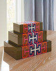 Jonathan Adler Lacquer Madrid Large Box showcases a vivid geometric design decorated with other sizes boxes available at Spacio India for luxury home decor accessories collection of decorative boxes.