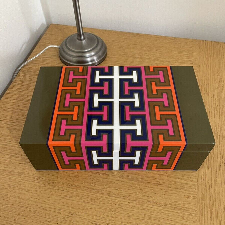 Jonathan Adler Lacquer Madrid Medium Box showcases a vivid geometric design on a wood table available at Spacio India for luxury home decor accessories collection of decorative boxes.