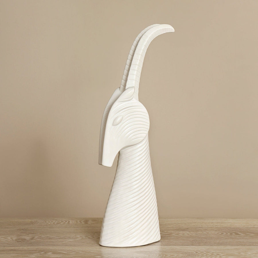 Side look of Jonathan Adler on Menagerie Gazelle white Sculpture on wood surface available at Spacio India for Luxury Home Decor collection of Sculpture & Art Objects.