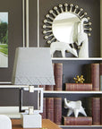 Jonathan Adler Menagerie Gazelle white Sculpture on a book shelf with other animal sculptures available at Spacio India for Luxury Home Decor collection of Sculpture & Art Objects.