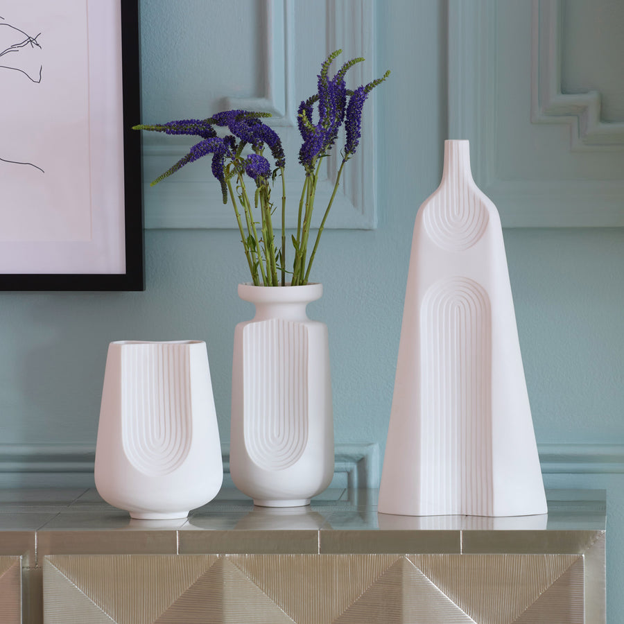 Jonathan Adler Arco large porcelain vase with other sizes of arco collection on a console table in interior available at Spacio India for Luxury Home Decor Accessories collection.