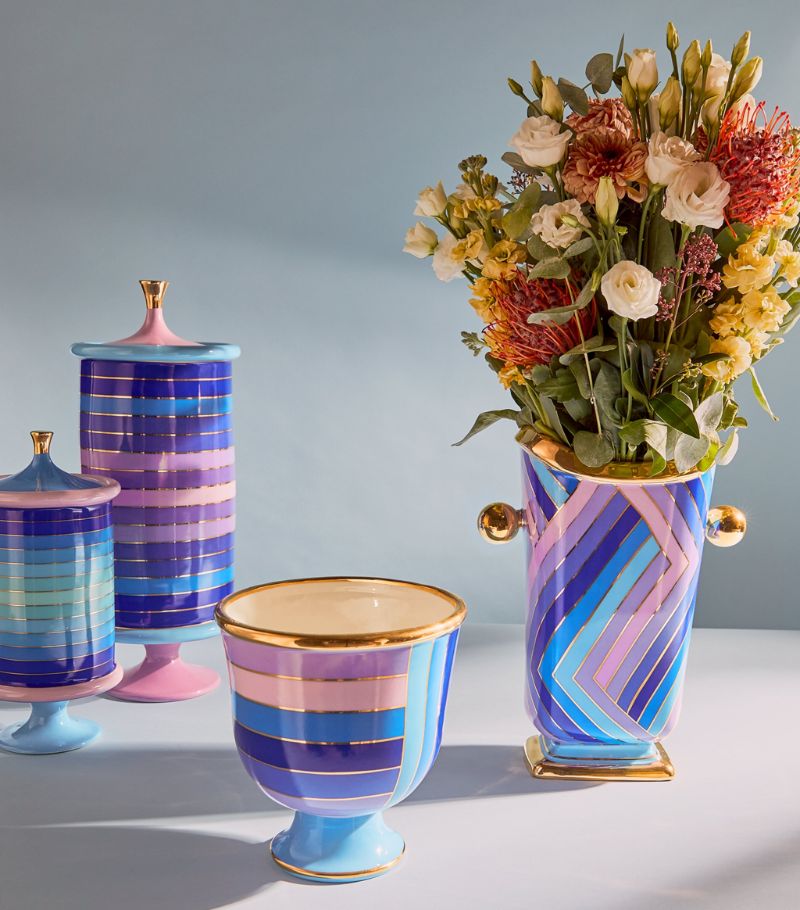 Jonathan Adler Scala Stripe Canister Vase on a grey surface with scala bowl & canisters available at Spacio India for Luxury Home Decor Accessories collection.