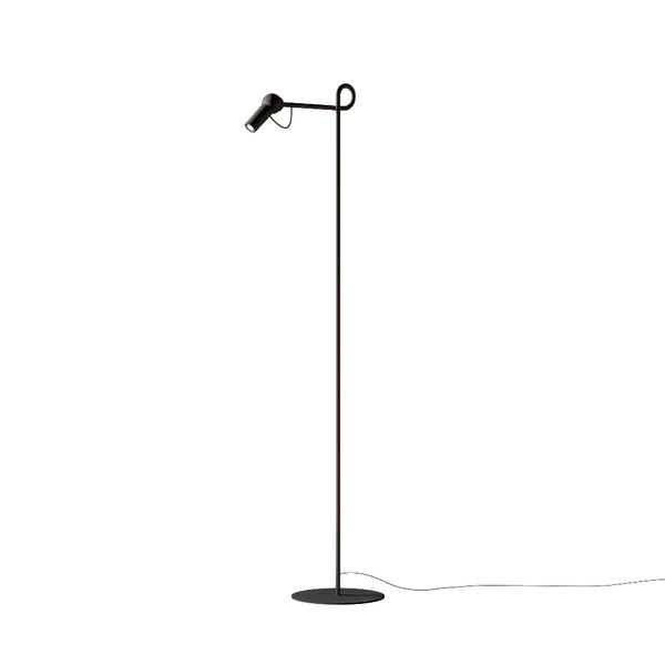 Black floor lamp with adjustable head on a white background from KDLN available at Spacio retail stores in Mumbai & Kolkata. 