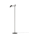 Black floor lamp with adjustable head on a white background from KDLN available at Spacio retail stores in Mumbai & Kolkata. 