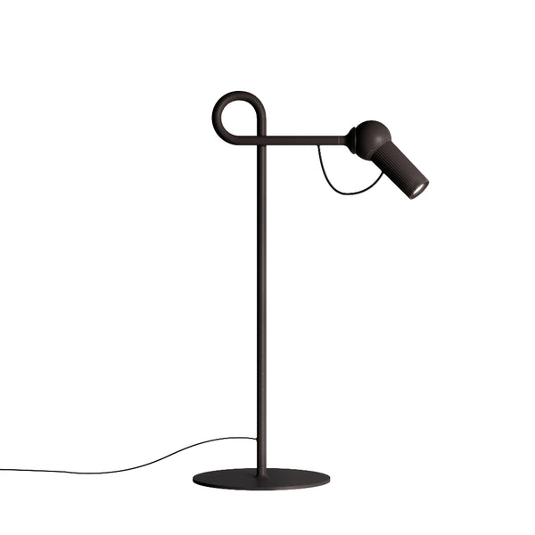 Modern black floor lamp with adjustable head on a white background from KDLN available at Spacio retail stores in Mumbai & Kolkata. 