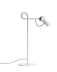 Modern white floor lamp with adjustable head on a white background