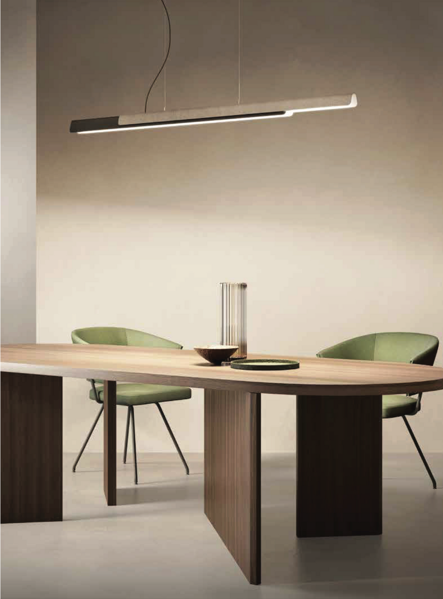 A modern dining room with a wooden table and chairs, featuring the KDLN Dala Linear Home Office Desk Ceiling Light for a harmonious synthesis of form and function.