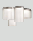 A KDLN Giass Ceiling Light, a retro style ceiling light with three glass cylinders hanging from it, resembling tumblers.