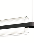 A black and white KDLN Nami Suspension pendant lamp with a black frame and diffuser.