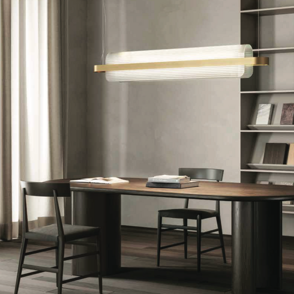 A modern office with a wooden desk, bookshelves, and a KDLN Nami Suspensesion Home Office Desk Ceiling Light diffuser.