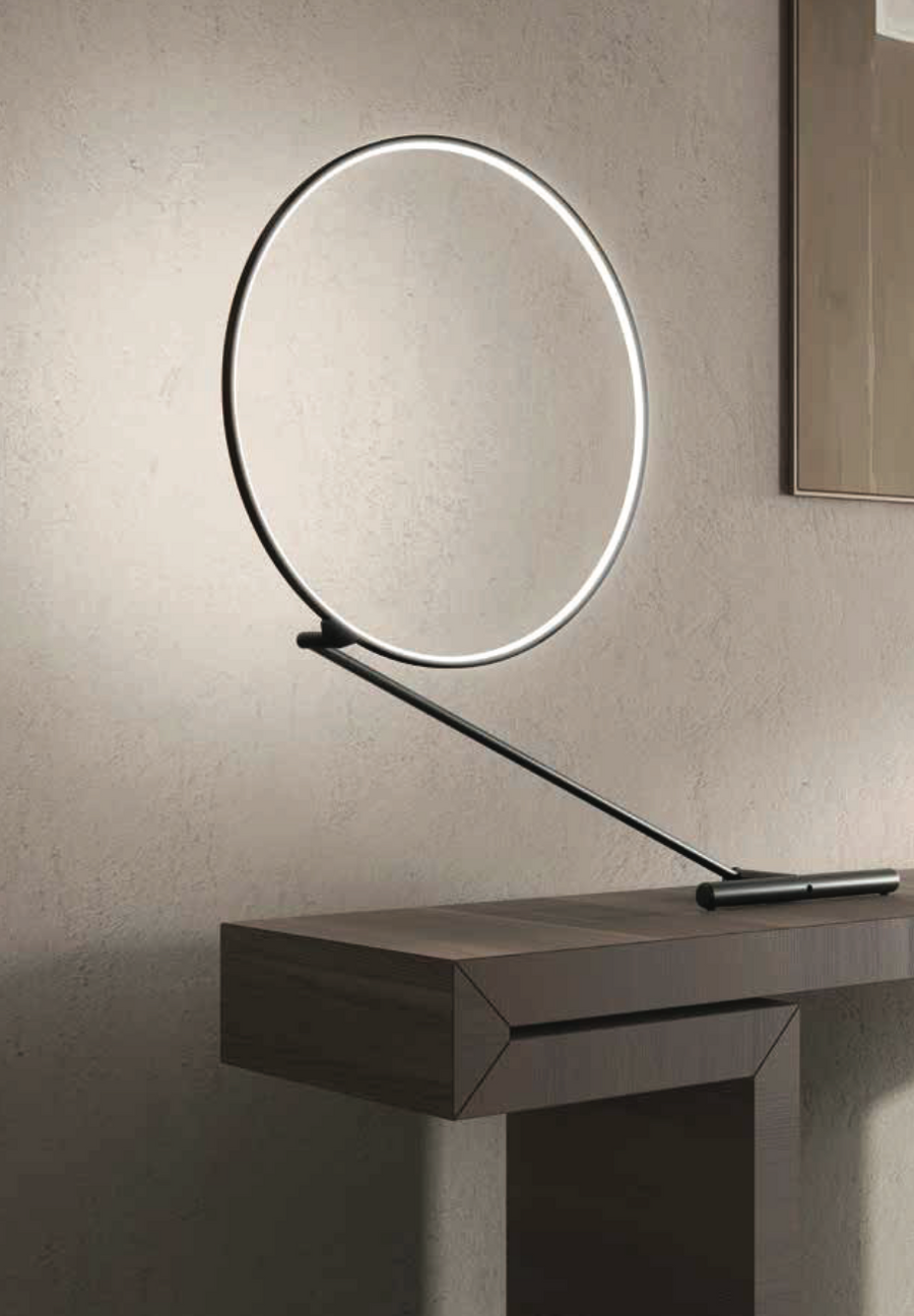 An adjustable KDLN Poise Table Lamp with a circle of light on top.