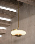 KDLN Tratto Suspension Light Spacio India in brass finish in a contemporary interior below  staircase