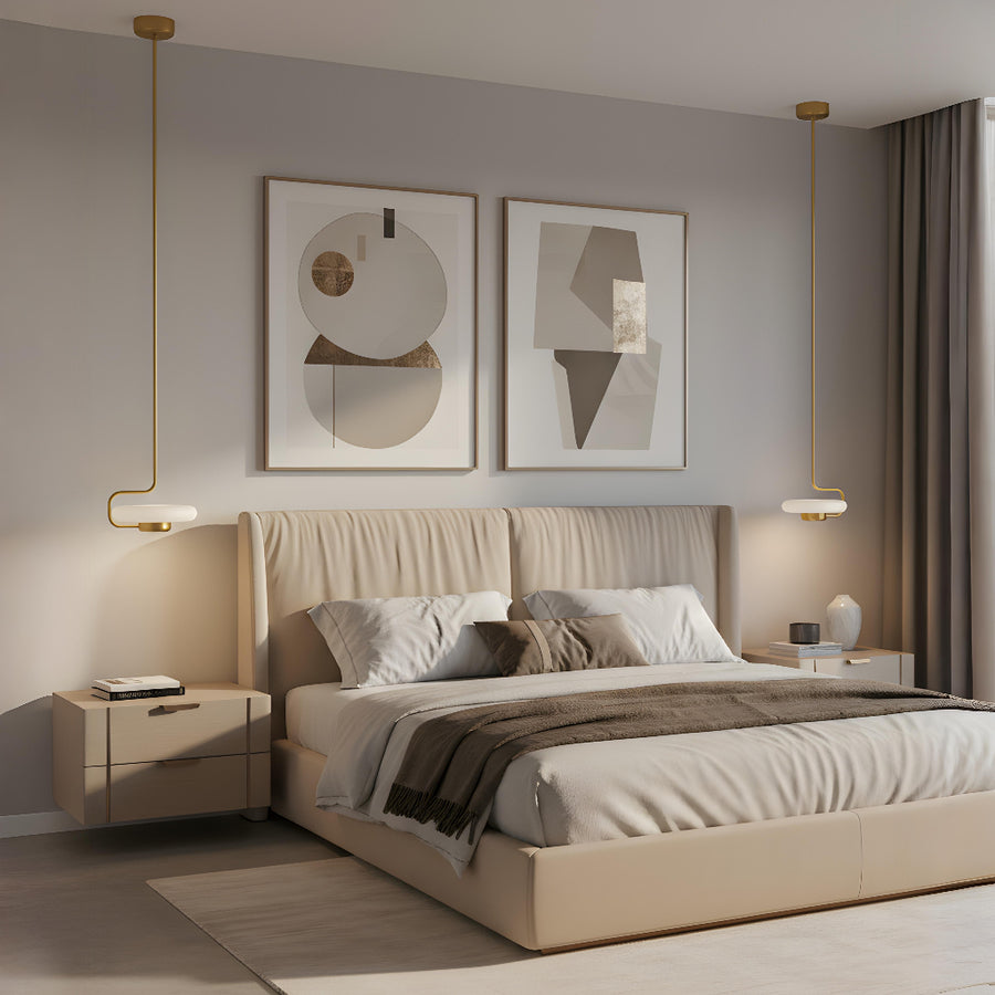 Modern bedroom with beige bed, nightstands, abstract wall art and hanging pendant light from KDLN, styled by interior stylists from Spacio's Mumbai store. 