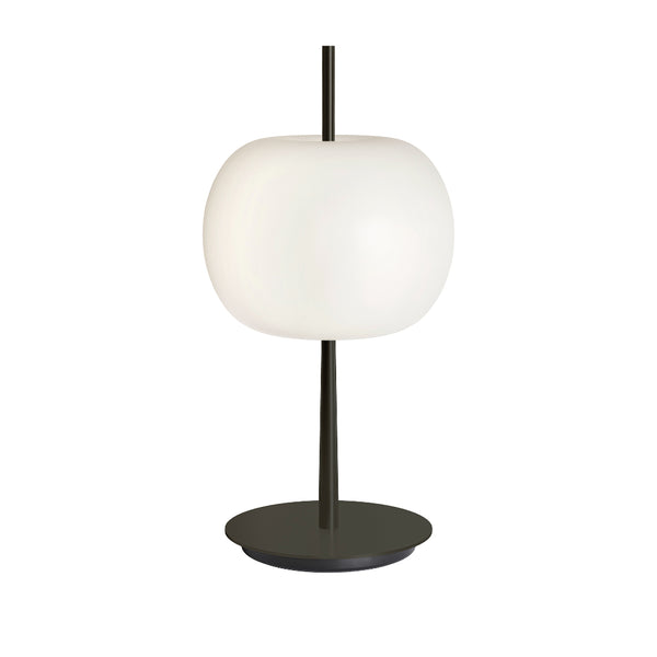 Table lamp with a white apple shaped glass and black base on a white background