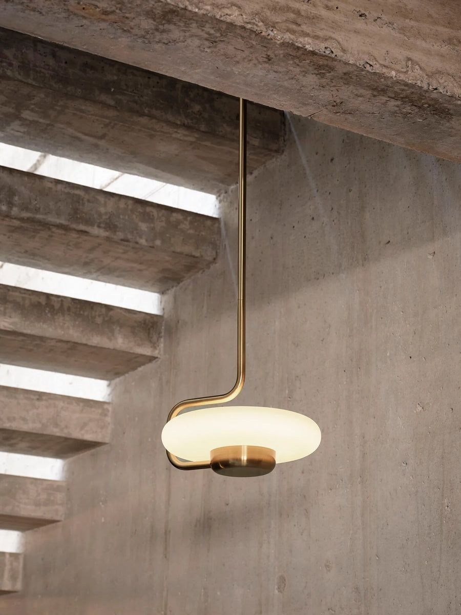 KDLN Tratto Suspension Light Spacio India in brass finish in a contemporary interior below  staircase