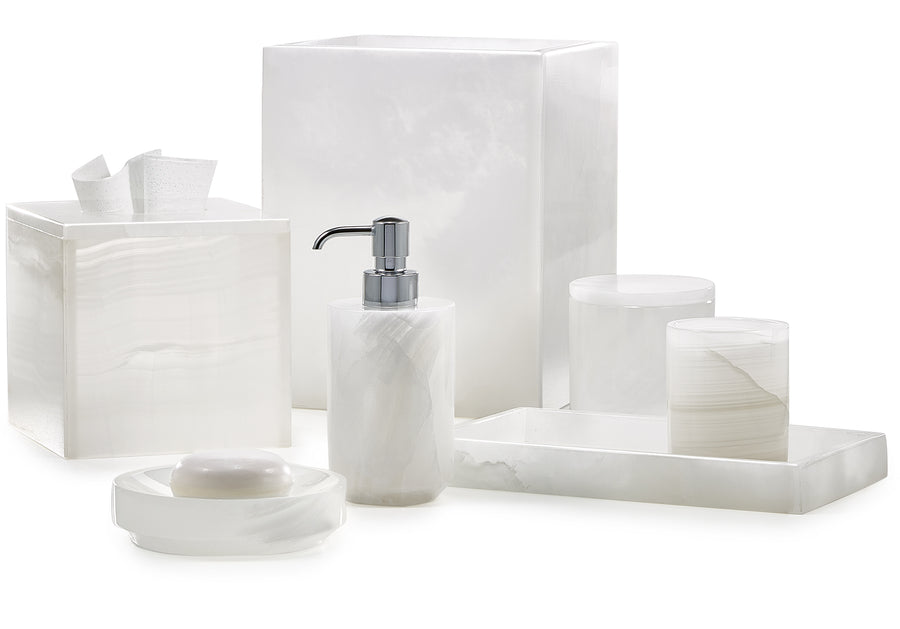 White onyx marble bathroom accessories from Labrazel including a soap dispenser, tray, and containers on a white background at Spacio retail store in Mumbai