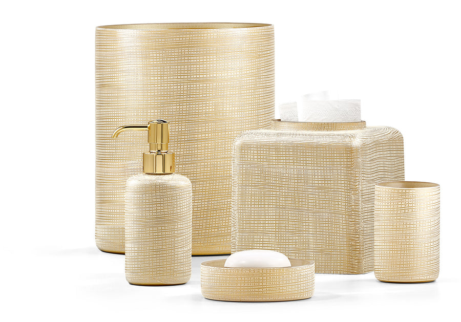Set of beige textured woven gold bathroom accessories set from Labrazel including a bottle, container, and bowl on a white background at Spacio retail store in India