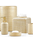 Set of beige textured woven gold bathroom accessories set from Labrazel including a bottle, container, and bowl on a white background at Spacio retail store in India