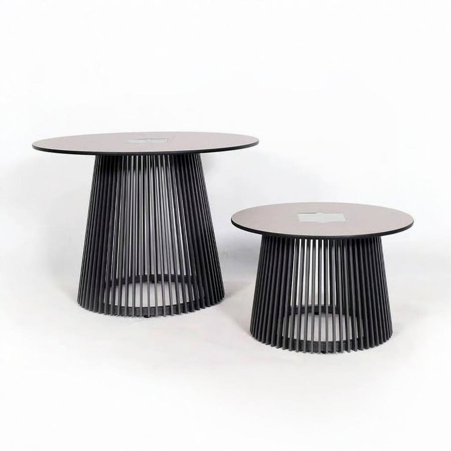 Two modern outdoor side tables with black metal legs and pinkish-brown circular tops on a white background and solar lighting from Les Jardins, available at Spacio retail stores in Mumbai & Kolkata.