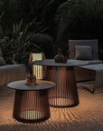 Outdoor patio setting with modern furniture integrated with solar lighting from Les Jardins available at Spacio retail stores in India. 