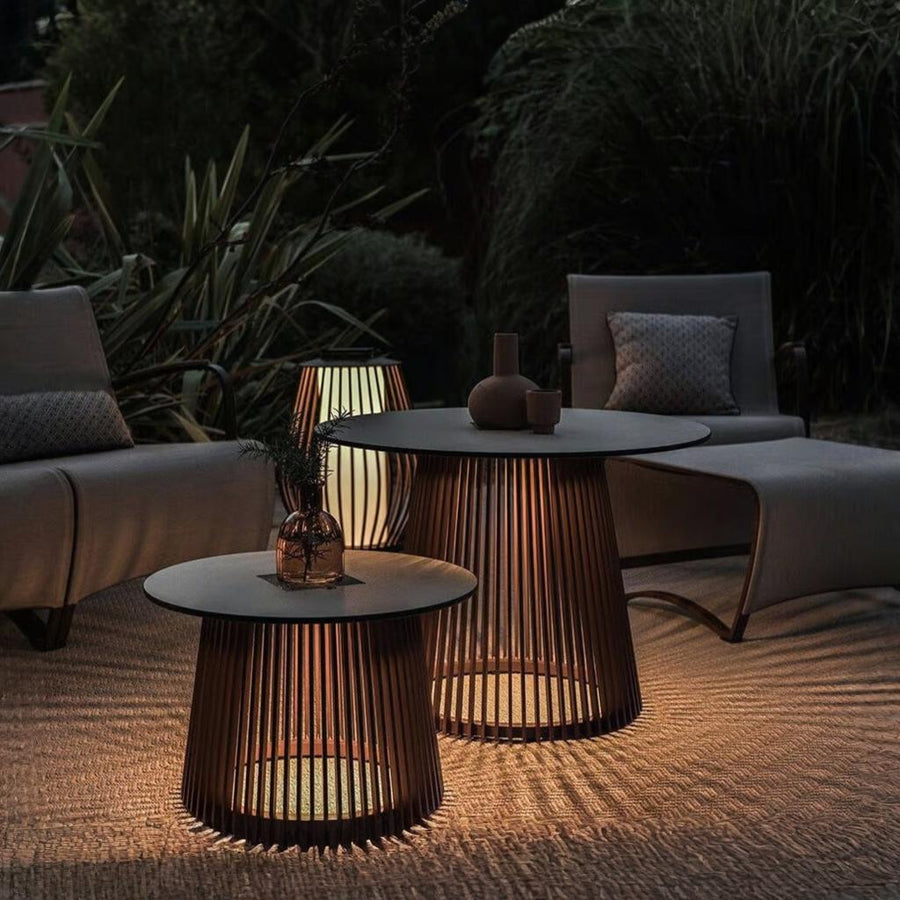 Outdoor patio setting with modern furniture integrated with solar lighting from Les Jardins available at Spacio retail stores in India. 