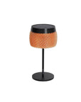 Small round solar table with orange woven top and black base on a white background by Les Jardins available at Spacio retail stores in Mumbai & Kolkata.  