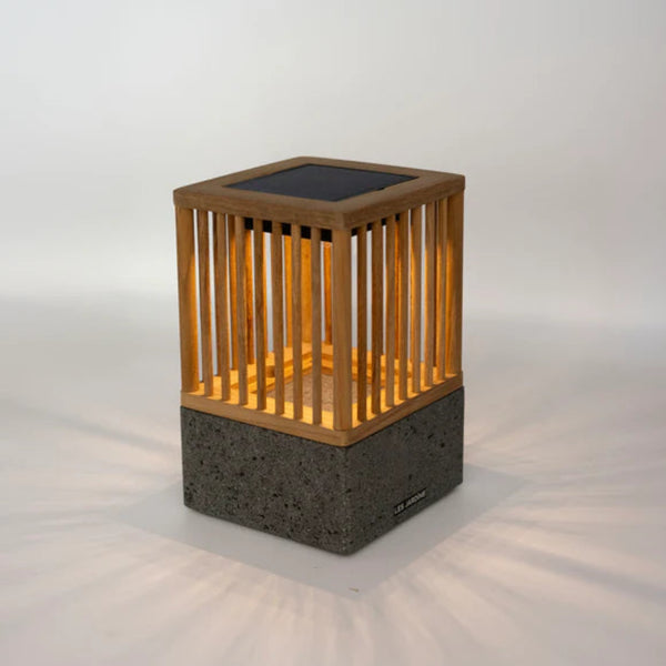 Solar-powered outdoor lamp with wooden top and concrete base on a white background by Les Jardins available at Spacio retail stores in Mumbai & Kolkata.  