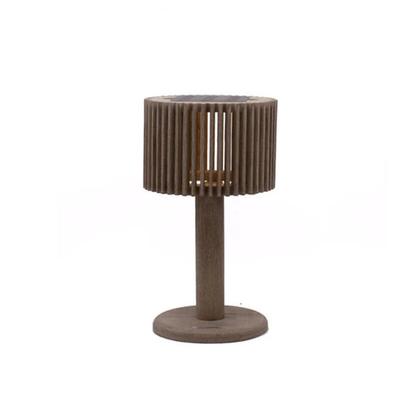 Small round solar table lamp with a textured surface on a white background by Les Jardins available at Spacio retail stores in Mumbai & Kolkata.  