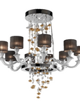 Decorative chandelier with crystal accents and black lampshades on a white background