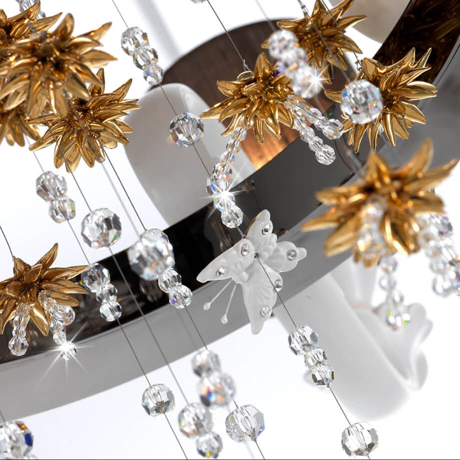 Decorative chandelier with gold star-shaped crystals and clear beads